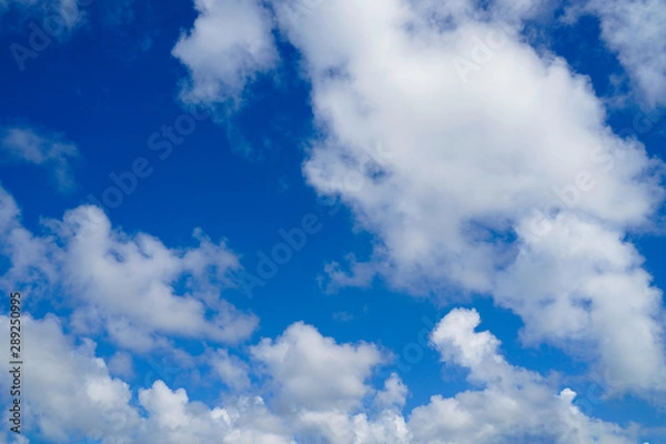 Obraz Blue sky and white clouds background.