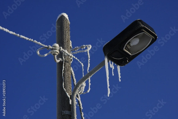 Fototapeta Straßenlampe mit Eis