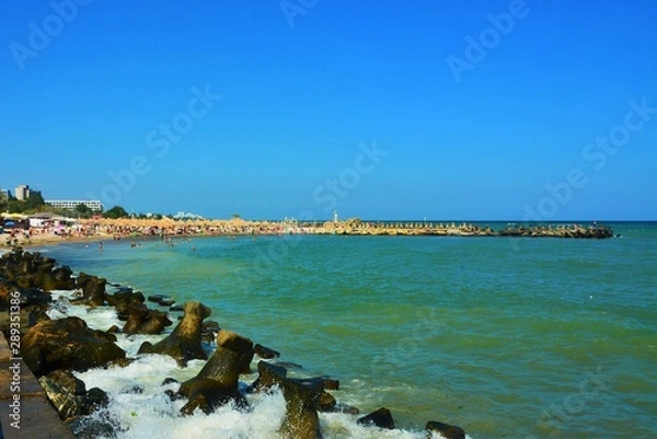 Fototapeta the waves of the sea breaking from the tetrapod stable