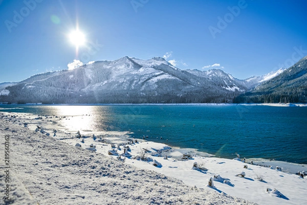 Fototapeta Cascade Mountain By Keechenus Lake And The Surrounding field is covered With Ice Cold White Snow, Snoqualmie Pass, Washington, United States.