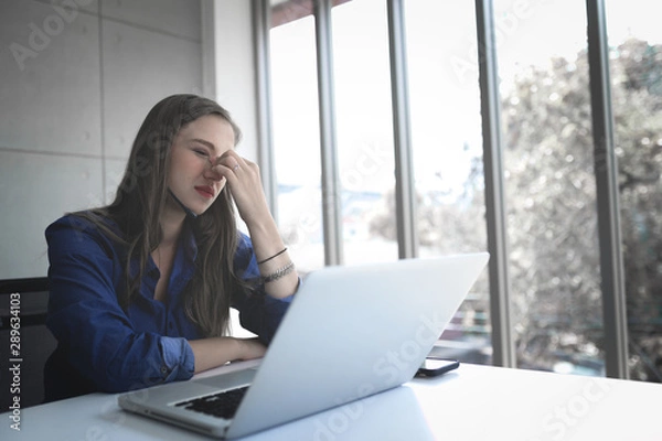 Fototapeta Call Center Service. Photo of customer support or sales agent.  Help line answering and telemarketing. Female caller or receptionist phone operator. Call center staff headaches with the service.