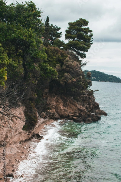 Fototapeta Vocation in Greece, Corfu. Water, cliff, mountains, and beautiful summer evening 