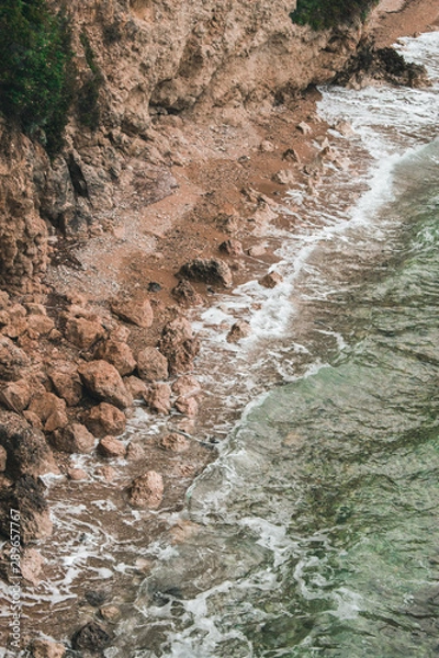 Fototapeta Vocation in Greece, Corfu. Water, cliff, mountains, and beautiful summer evening 