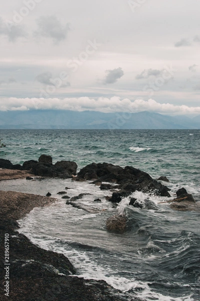 Fototapeta Vocation in Greece, Corfu. Water, cliff, mountains, and beautiful summer evening 