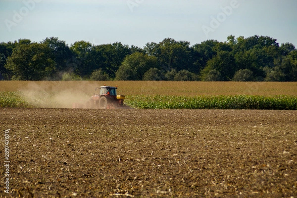 Fototapeta tractor working in field