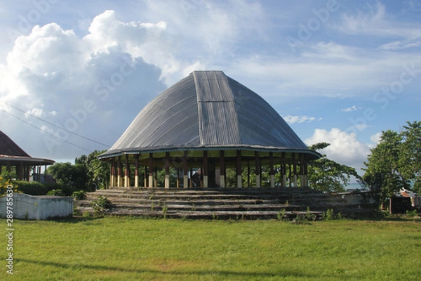 Fototapeta The fale tele (big house), the most important house, is usually round in shape, and serves as a meeting house for chief council meetings, family gatherings, funerals or chief title investitures. 