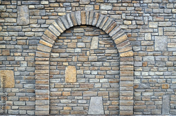 Obraz  Walled-up archway in a stone wall