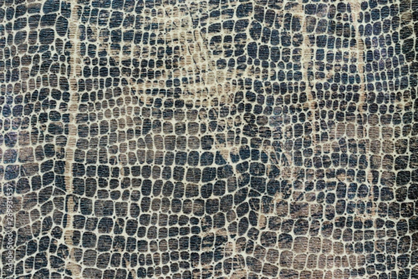 Obraz Background in the form of a knitwear product with a pattern similar to the skin of a snake in various shades of brown and gray