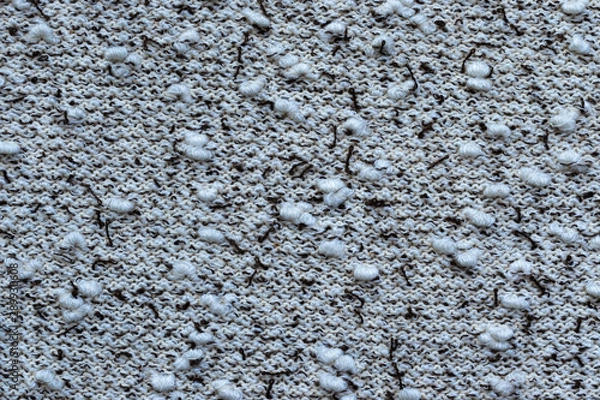 Obraz Background in the form of a knitwear with soft white boucle and dark brown veins on a light background