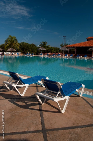 Fototapeta Sun chairs by the pool