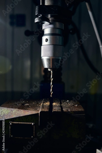 Obraz Drilling machine with an inserted drill in the chuck. Close-up.