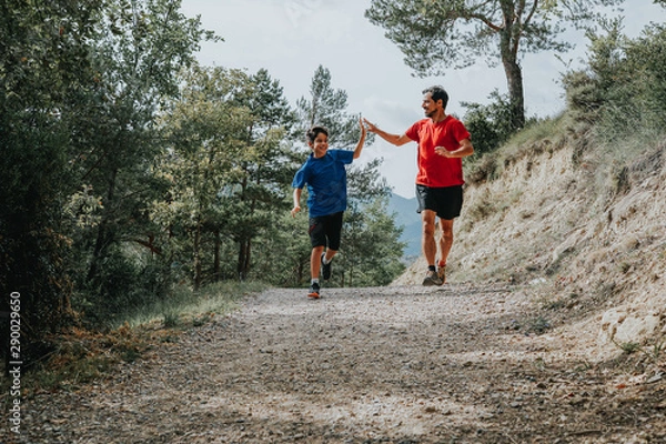 Obraz father and son running in the mountain