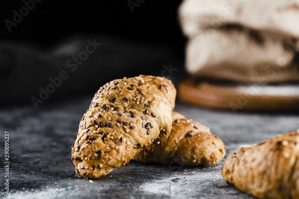 Obraz Front view of croissants on black background