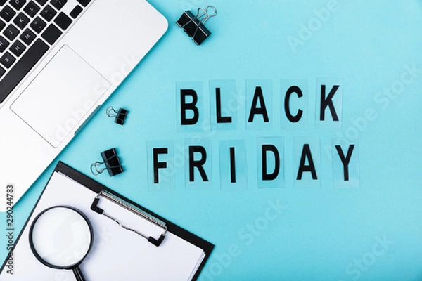 Fototapeta Flat lay of desk with black friday text