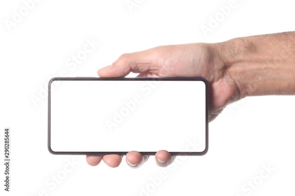 Obraz male man holding and showing  blank smart phone isolated  on white background  with clipping path around hand and display with copy space for your text