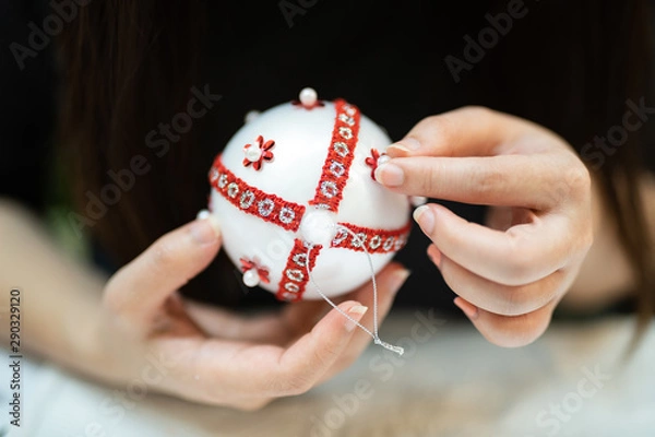 Obraz Creative diy hobby. Making handmade craft white stylish Christmas balls with lace.