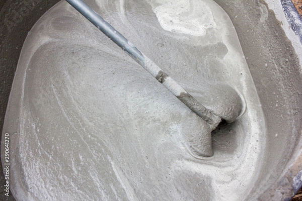 Fototapeta Mixing cement for construction