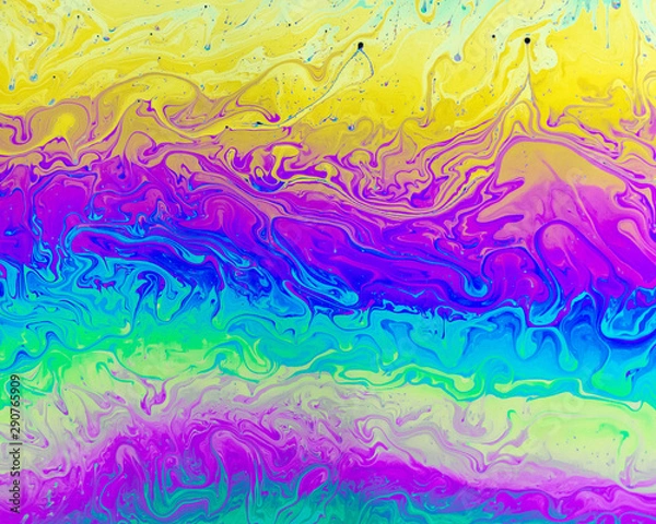Obraz A creative abstract swirling liquid rainbow of colours that looks like watercolour paints or inks that makes an interesting vibrant background