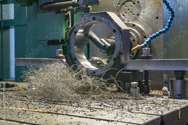Fototapeta Processing of parts on a CNC boring machine, shavings lie on the machine.