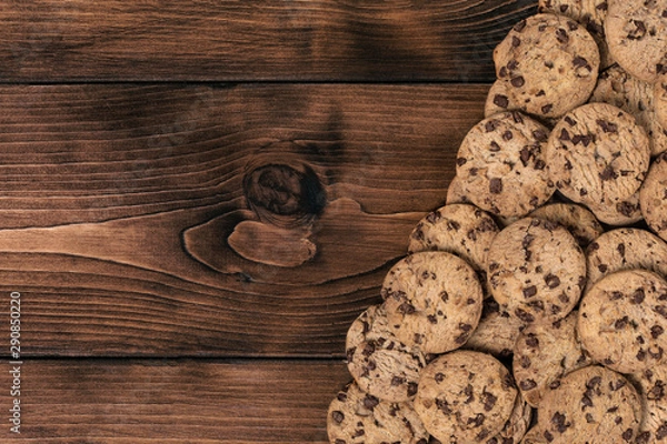 Fototapeta Chock chip cookie on wooden table with copy space. Top view. Flat lay