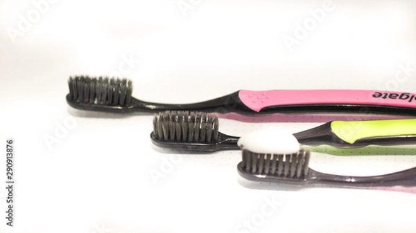 Fototapeta Toothbrush Isolated on white Background. Tooth Brushes Scattered on Table. Collection of Elegant Clear Healthcare Bath Accessory for Clean Teeth