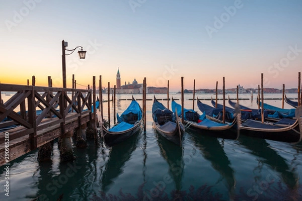 Fototapeta Sunrise at Venice with gondola and island of st george view from the square San marco