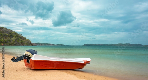 Fototapeta Orange color motor boat at Marble beach in Trincomalee, Sri Lanka