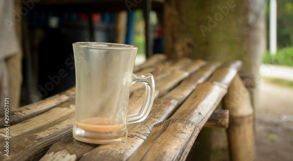 Fototapeta cup of tea on wooden table in local cafe in Bangladesh