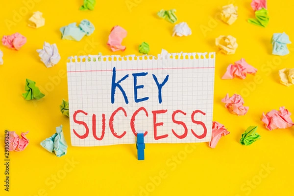 Obraz Word writing text Key Success. Business photo showcasing generally three to five areas that company may focus on Colored crumpled papers empty reminder white floor background clothespin