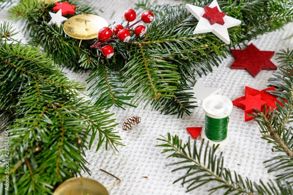 Fototapeta Decoration of handmade red and white advent christmas wreath from fir