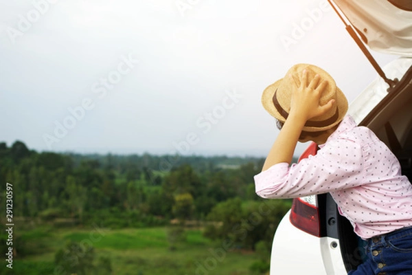 Obraz Asian girl traveling with a car on holiday.