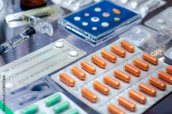 Fototapeta Close-up of different pills in a blister pack.