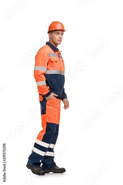 Fototapeta Man in working clothes and helmet profile view