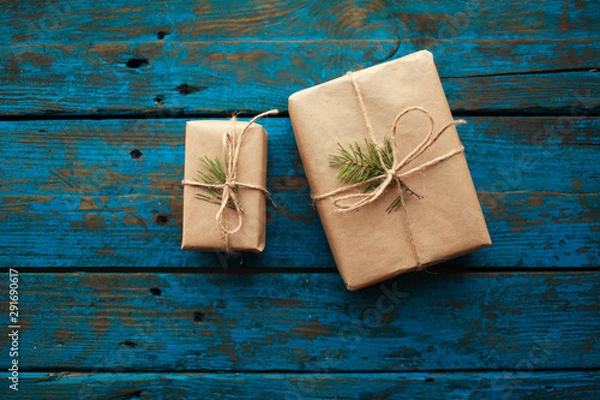 Obraz Christmas present on blue wooden table