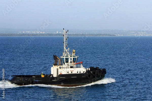 Obraz Tugboat under power at sea.