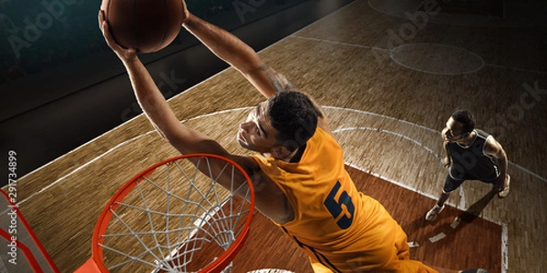 Obraz Two basketball players plays near the hoop. High angle view from the basketball rim	