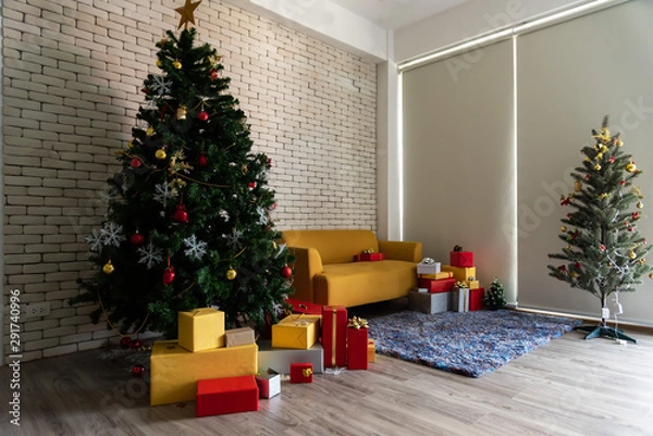 Fototapeta The  living room in the loft is decorated with a Christmas tree. Square. Concept of Happy Christmas, New Year, holiday, background.