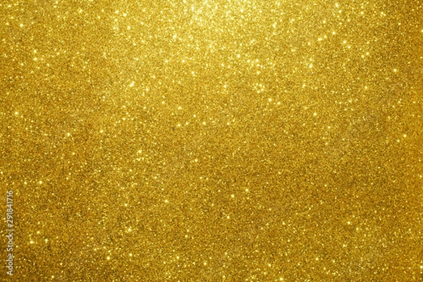 Fototapeta gold Sparkling Lights Festive background with texture. Abstract Christmas twinkled bright bokeh defocused and Falling stars. Winter Card or invitation