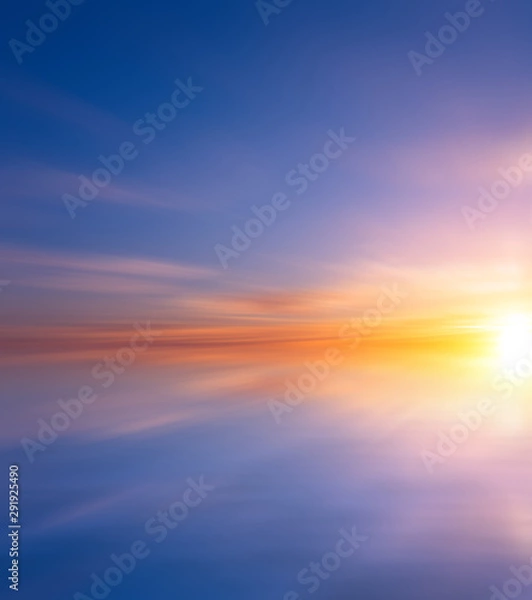 Obraz Sunset over the sea on a spring cloudy evening.