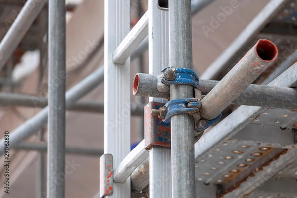 Obraz Construction scaffolding as temporary structure for support safety in construction site for new build building and platform for workers to work.