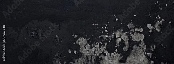 Obraz old black paint texture peeling off the concrete wall for dark theme banner background