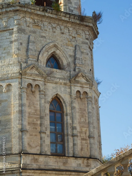 Fototapeta Facade with window of Orthodox church of the 18th century. Pseudo-Gothic style of architecture.