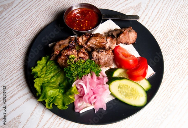 Obraz beef meat on a plate of vegetables