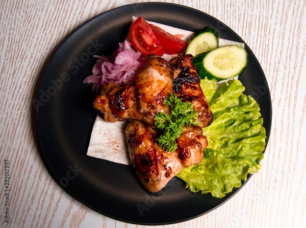 Obraz chicken wings with vegetables on a plate