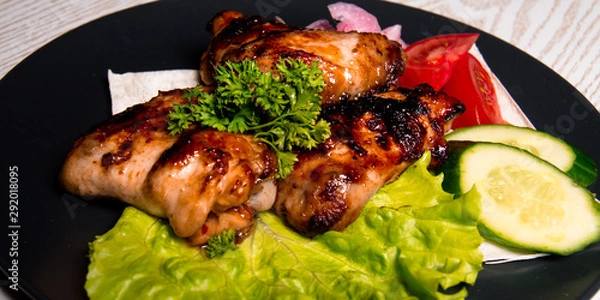 Obraz chicken wings with vegetables on a plate