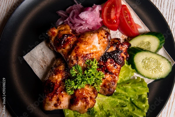 Obraz chicken wings with vegetables on a plate