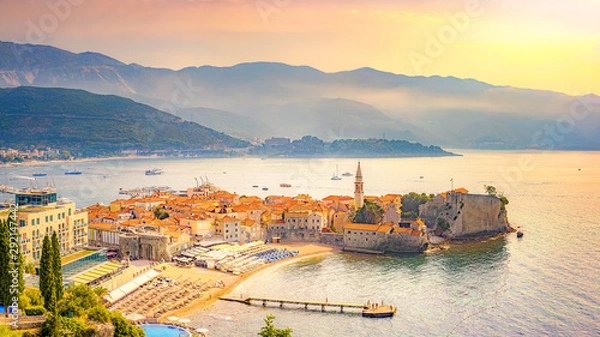 Obraz View of the old city of Budva, Montenegro. A sandy beach near the walls of the city (Richard the Head). Morning Mediterranean landscape.
