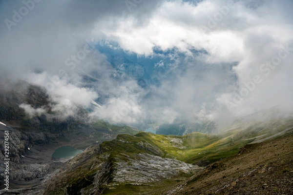 Fototapeta deep hanging clouds over Rossbode See on a rainy summer afternoon