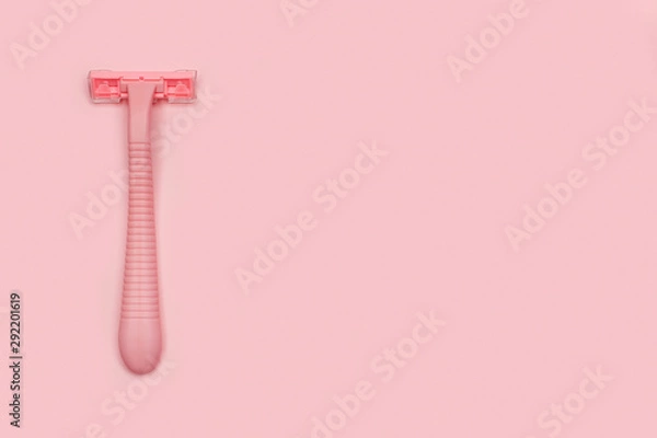 Obraz Pink woman shaver isolated on pink paper background. Copy space, place for text. Flat lay. Shaving concept.