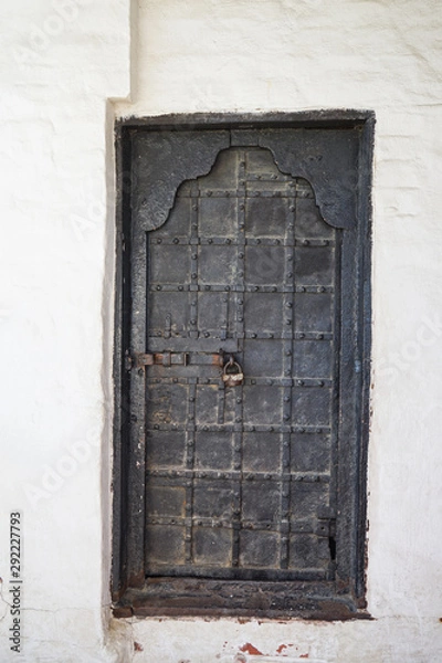 Obraz Black old metal door with iron key lock